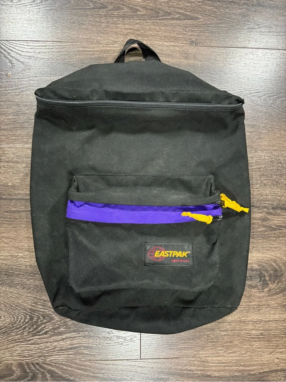 Eastpak Black Backpack with Purple Trim and Yellow Pulls